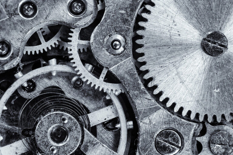 Systemische Führung, Symbolbild: ineinandergreifende Zahnräder